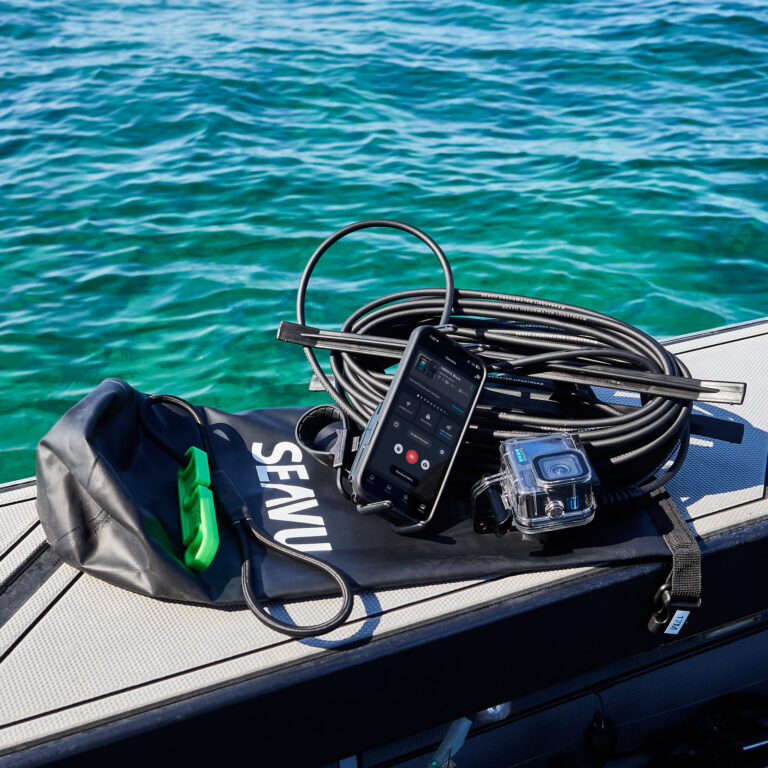 Seavu Seeker Starter Kit on boat with GoPro Hero13 in waterproof case connected to iPhone via receiver and transmitter